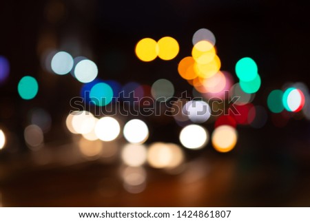 Bokeh traffic light at night in the city street.