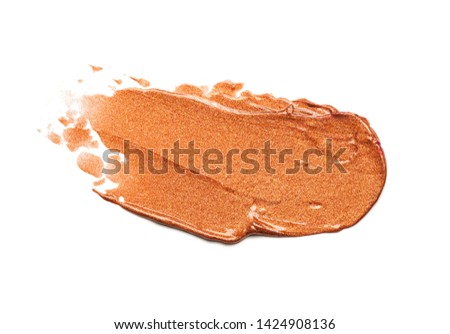 Lipstick abstract strokes smudge  background texture golden brown colored isolated on white