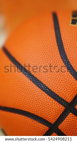 Closeup detail of orange basketball ball texture background