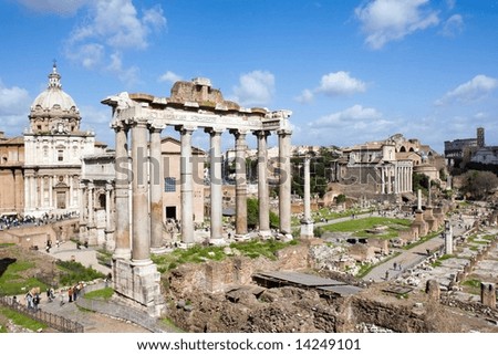Color DSLR picture of the ancient Forum in Rome, Italy, a popular and historic tourist destination and landmark with a blue sky background.  Horizontal orientation with copy space for text