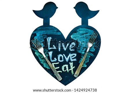 Isolated Illustrations of inscription on black chalkboard. Live, love, eat. isolated Chalk pictures set of fork and lifestyle ingredients on blackboard on white background.