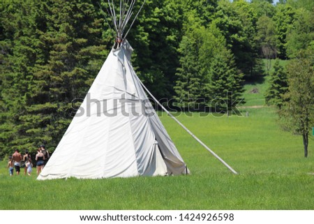 Teepee in forest on family day.  Tourism