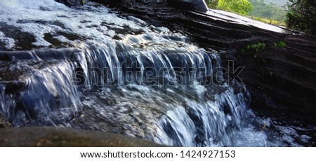 water flows from the waterfall