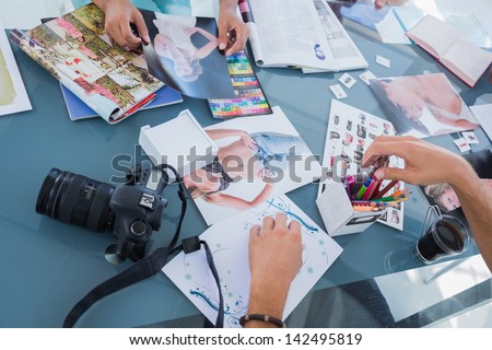 Pictures of photos and magazines used by photo editors