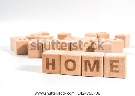word HOME on wood cube dices on white background.