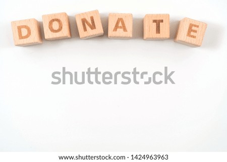 Donate wooden blocks of business concept isolated on white background.