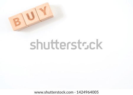 "BUY" wooden blocks of business concept isolated on white background.