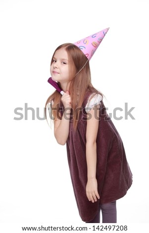Studio portrait of little girl in lovely dress with fife and holiday hat isolated on white background/Image of pretty joyful kid girl on birthday party