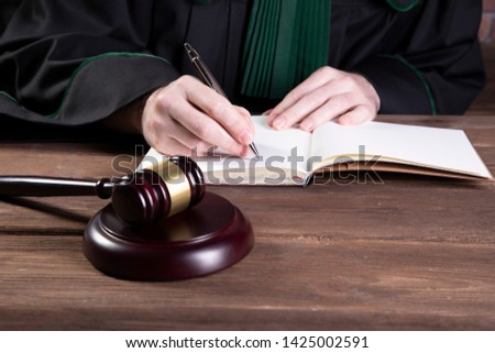 Judge signs the court order - verdict proclamation
