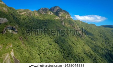 Marumbi set in Brazil in Morretes, Olimpo peak, 1513 meters high, one of the most difficult mountains and trails in southern Brazil, on a day of strong sun and practically cloudless sky, a spectacle o