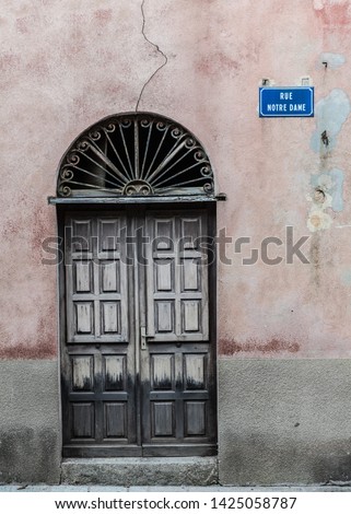 Old door in the streets of Ile Rousse