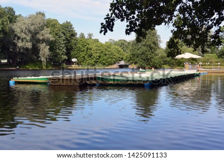 Photography background with boats on the pier in the park
