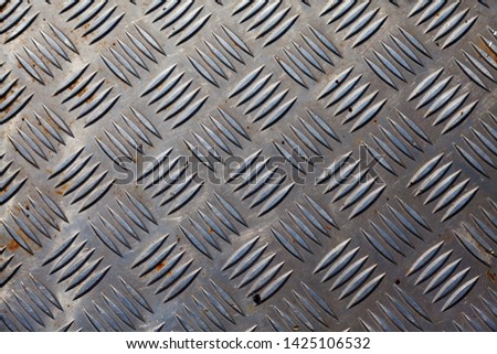 metal plate with herringbone pattern