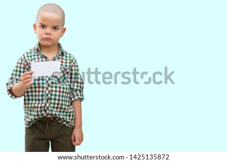 Cute boy standing with empty blank in hands, isolated on white