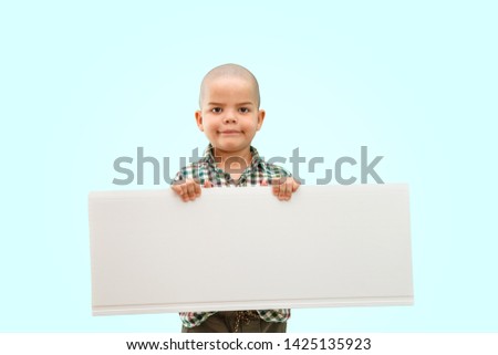 Cute boy standing with empty blank in hands, isolated on white