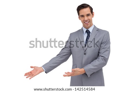 Smiling businessman giving a presentation with his hands on white background