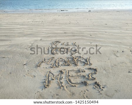 Close up view Hand writing on sand beach side I am sign blank use design elemental nature. Summer spring day Form words alphabet typescript font written drawn carved note text Spelled purpose wedding