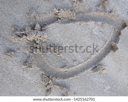 Close up view Hand writing on sand beach side with sign blank use design elemental nature. Summer spring day Form words english alphabet typescript font written drawn carved note text uppercase lower