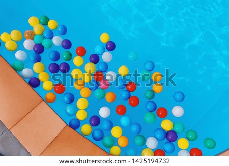 Ball in the swimming pool is colorful