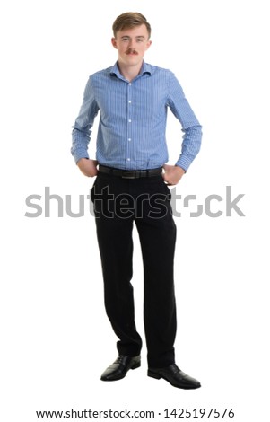 Happy young businessman in suit looking at camera on white background, isolated concept