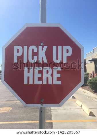 Pick up here sign near drivethru