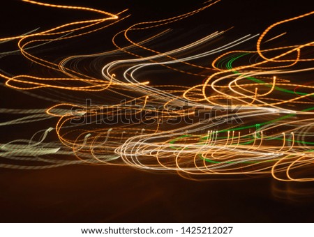 Beautiful blurred images of car lights with different characteristics that run on highway roads at night with speed. Long exposure photography techniques.