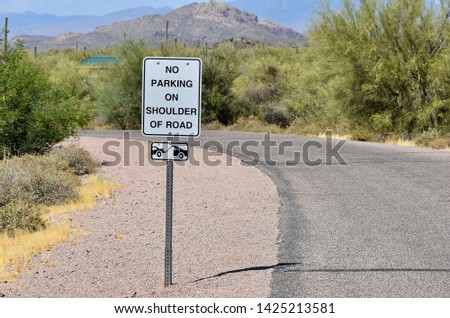 No Parking on Shoulder of Road Sign