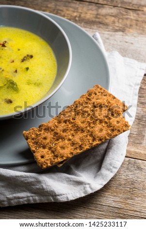 Hot pea soup with spices on the rustic background. Selective focus. Shallow depth of field.