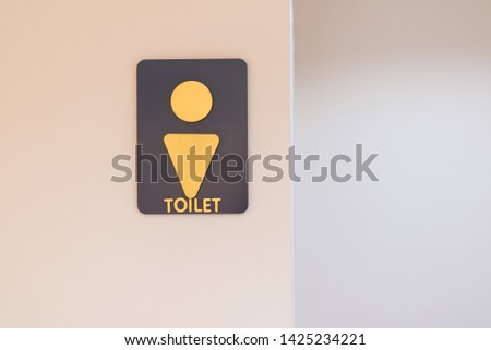 Male toilet sign on withe door background.Restroom sign on a toilet wall background.