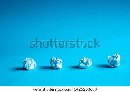 Trash ball paper crumpled isolated on blue background idea business concept