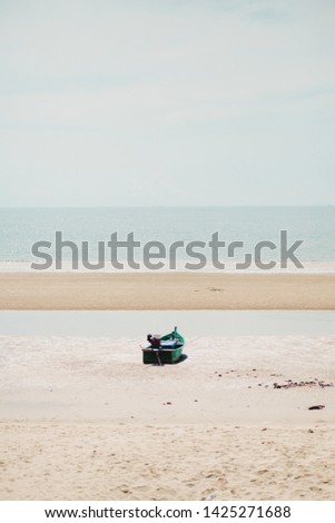 Boat on the sand at Pranburi, Prachuap Khiri Khan, Thailand.