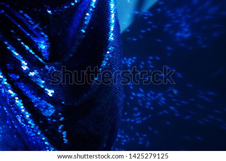 Fashion blue material. Metallic fabric material. Fashion background