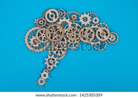 Brain from gears. on blue background. Business concept, idea, strength, learning, thought process, mind