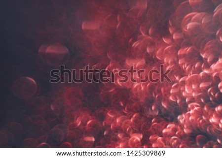 Beautiful red bokeh on a dark abstract background.