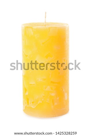 Scented color wax candle on white background