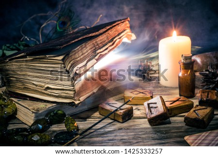 Magic book and witchery objects, 
the practice of magic, enchantment, sorcery Royalty-Free Stock Photo #1425333257