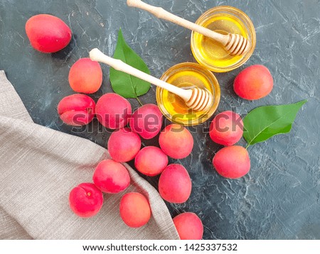 fresh peach honey on concrete background