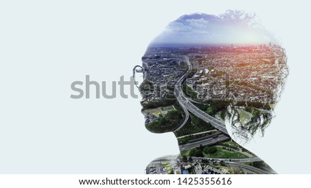 Human and society concept. modern cityscape and woman silhouette. Royalty-Free Stock Photo #1425355616