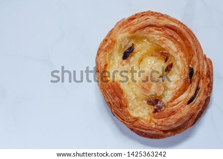 Top view of delicious bread on white marble background for food, bakery and eating concept