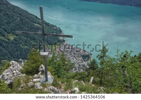 Amazing aerial view of Gersau and the beautiful turquoise waters of lake Lucerne form the Gersauerstock mountain peak