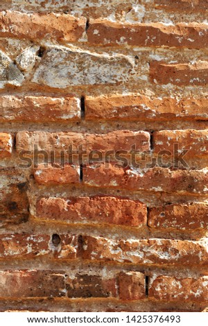 Old brick wall backgound and texture, simple and cheap construction material