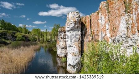 Panoramic footage of Russia nature; river valley, high, steep rocky slopes; relict vegetation, natural reserve of rare plants; place for climbing and active lifestyle; aerial drone view; South Ural