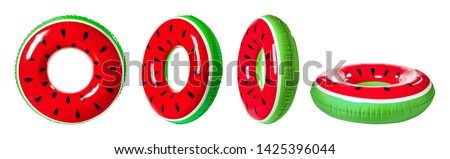 Set of bright inflatable rings on white background  Royalty-Free Stock Photo #1425396044
