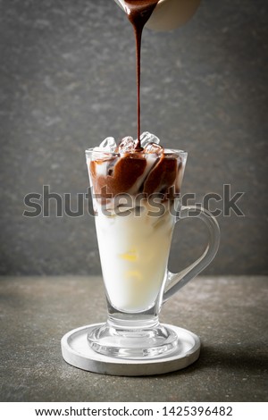 Iced chocolate milkshake drink on wood background