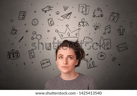 Pretty girl with drawn tasks above her head