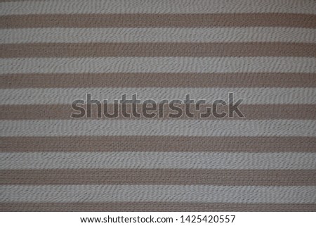 Rough texture background in beige and dirty white, made with horizontal stripes in brown tones
