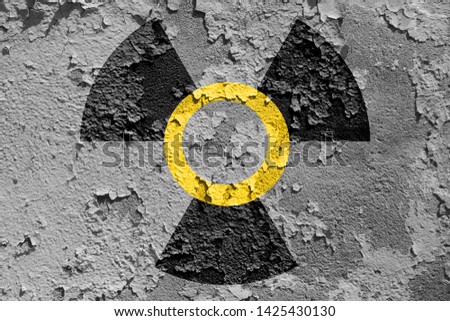 Radiation sign on old   wall