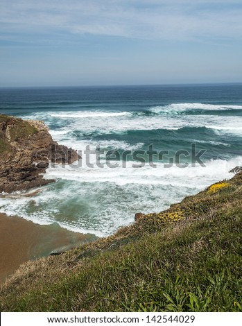 Santa Justa beach located on the coast of Cantabria to the north of Spain, ItÃ?Â´s a vertical picture with waves in the sea