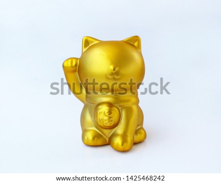 Gold color lucky cat, (Maneki Neko) Isolated on white background. (Japanese word means fortune)