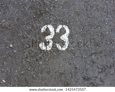 
Figure thirty-three, depicted on a dark asphalt.					